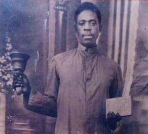 Ayo Babalola of the CAC holding a prayer bell