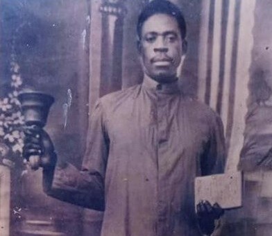 Ayo Babalola of the CAC holding a prayer bell
