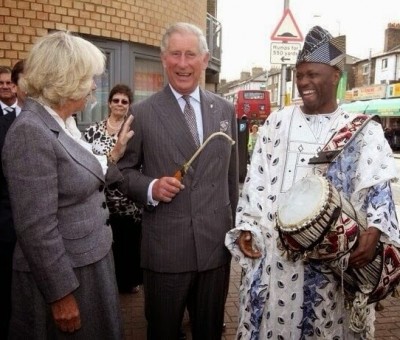 Appreciating the Talking Drum here is Prince Charles of Englad