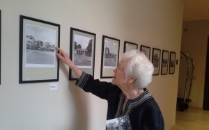 Gillian Hopwood inspecting her photo works